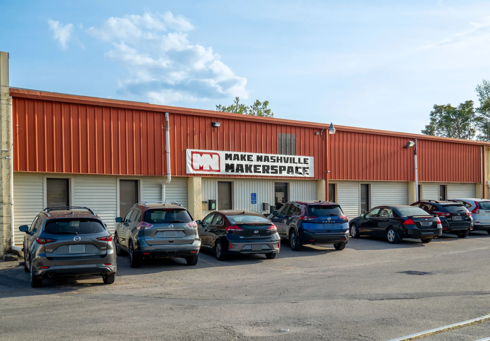 Make Nashville makerspace building exterior with red metal roof