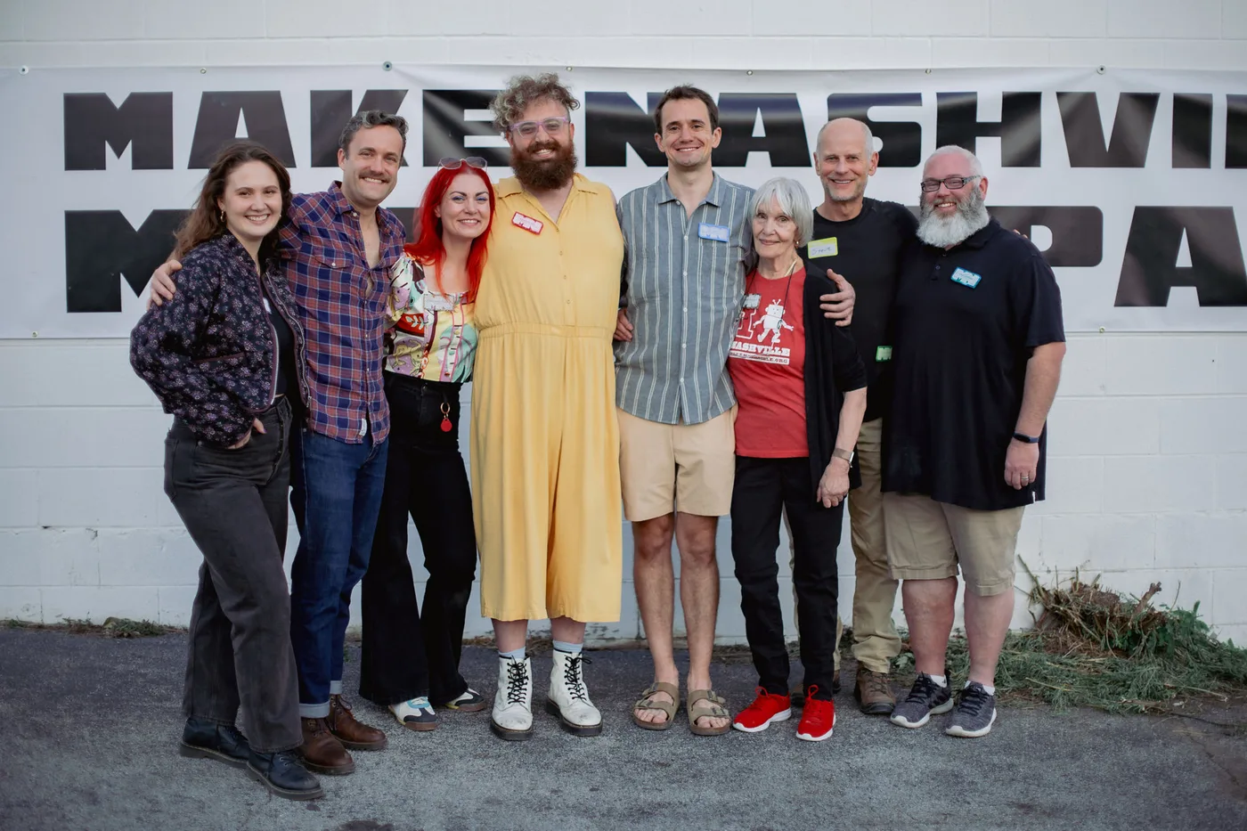 Group of Make Nashville members posing together in front of the makerspace