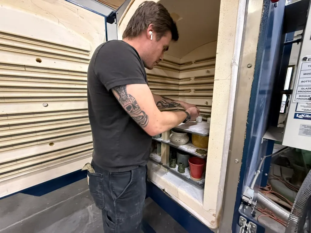 Loading Pottery Into Kiln Shelves
