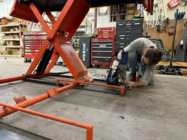 Working On Motorcycle Scissor Lift Frame
