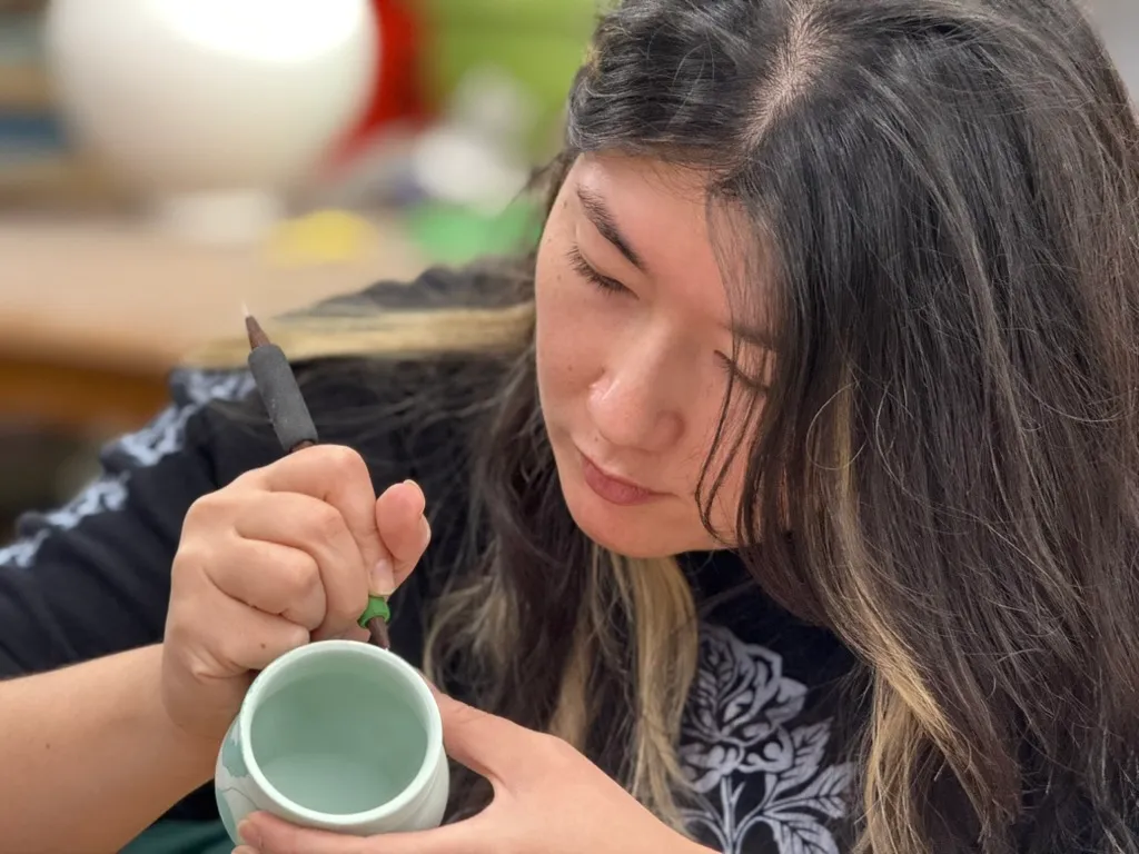 Close Up Of Carving A Ceramic Mug