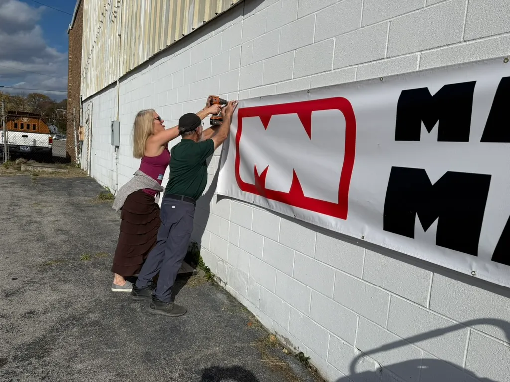 Installing Make Nashville Banner On Building
