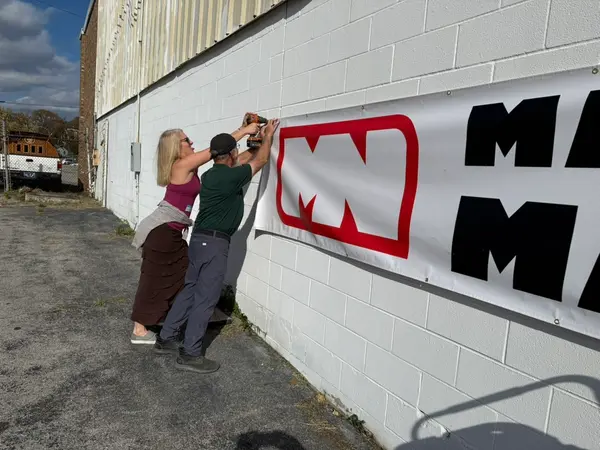 Installing Make Nashville Banner On Building