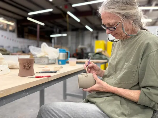 Ceramicist Carving Hand Built Clay Vessel